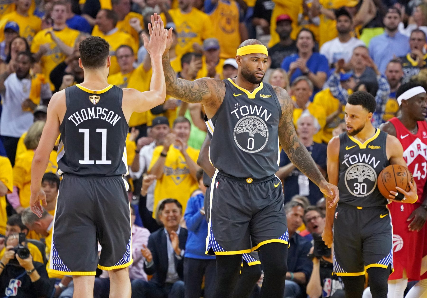 Klay Thompson, DeMarcus Cousins and Stephen Curry