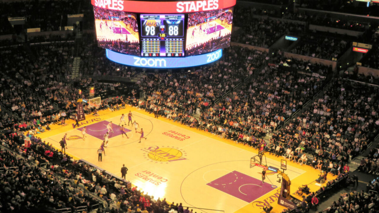 California bride and groom wear LA Lakers jerseys, take e-session photos at  Staples Center